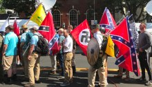 Rally participants carrying Nazi, Confederate and Gadsden flags near Emancipation Park, Charlottesville, August 12, 2017.